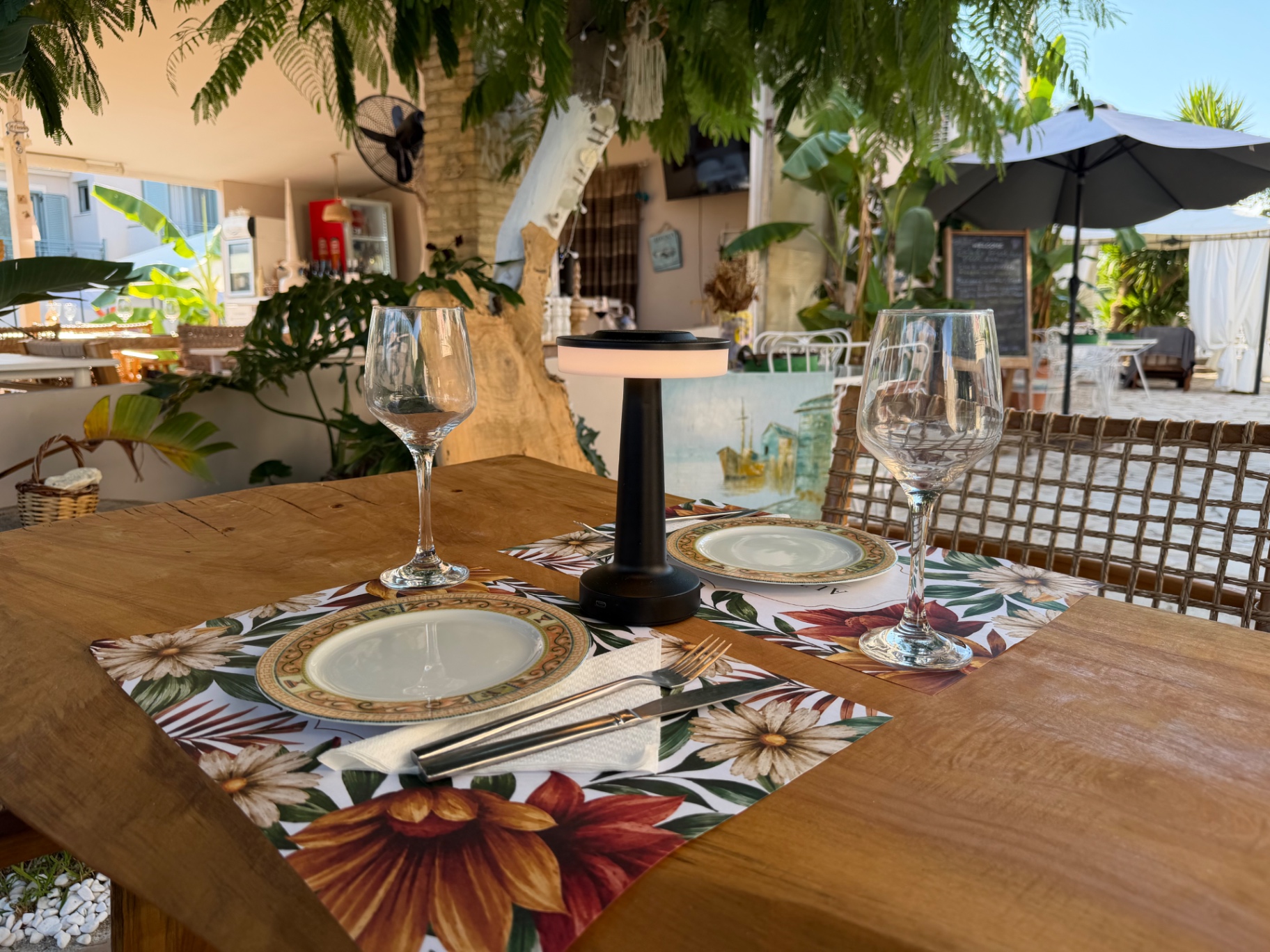 Table set under the banana trees