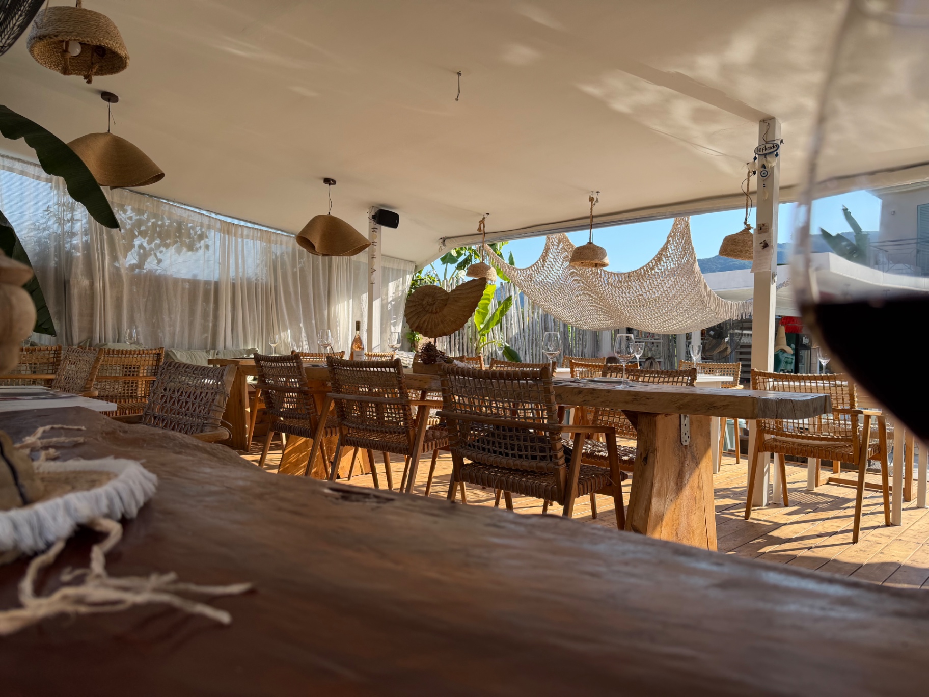 Wooden tables and rattan chairs